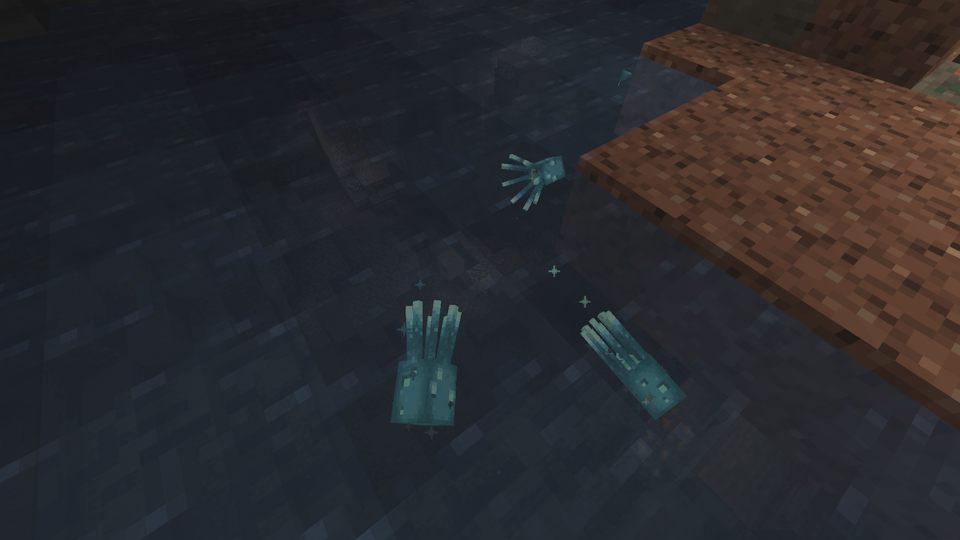 Three Glow Squid in an underground lake