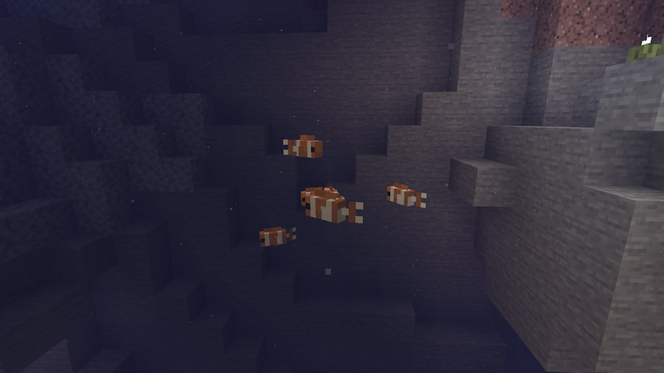 Clownfish school in a flooded cave